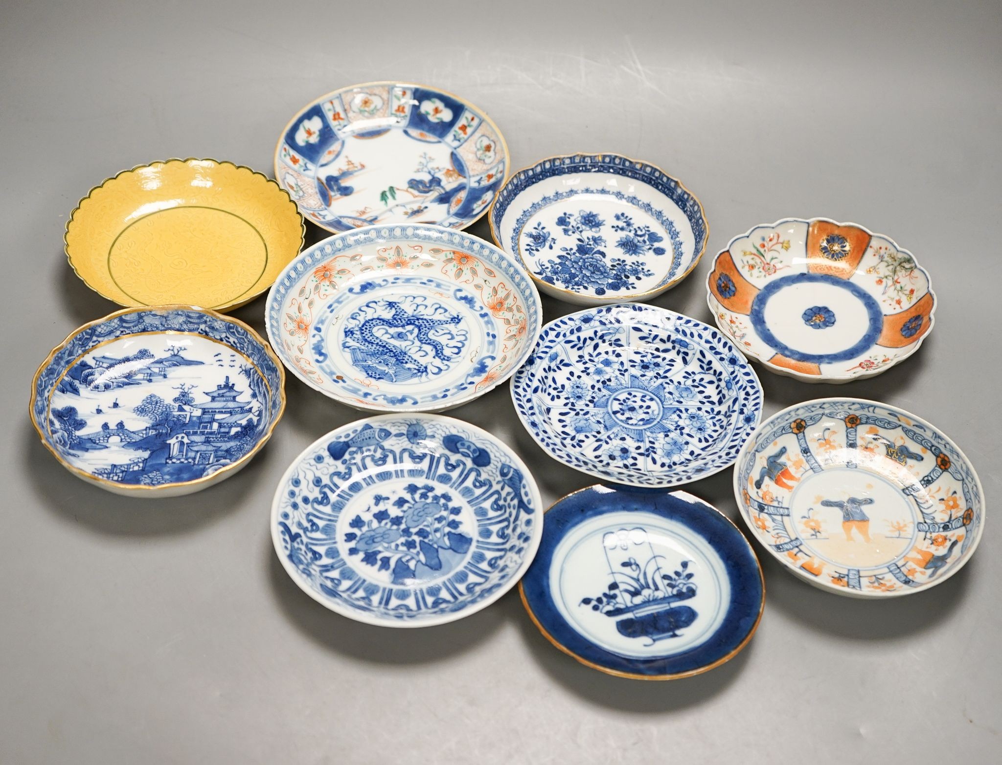 Ten various Chinese porcelain saucer dishes, largest 15cm